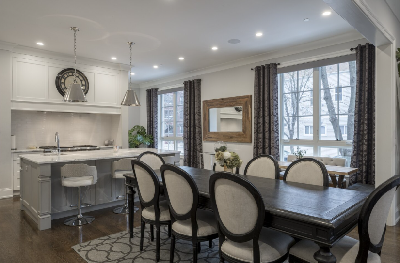 Modern open-concept kitchen and dining area with updated lighting and finishes that enhance buyer appeal.